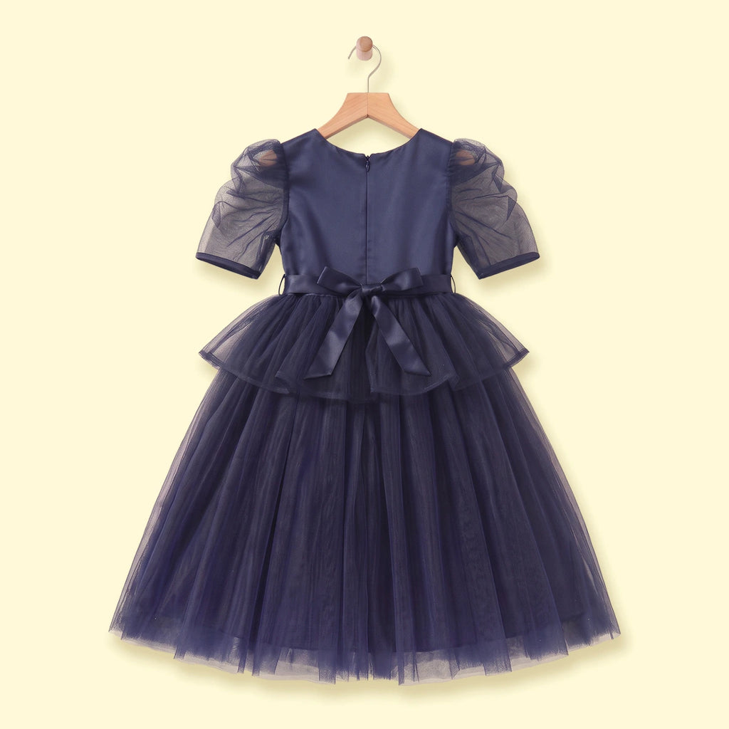 Girls navy blue party gown featuring puff sleeves and sequins