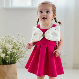 Girls Fuchsia Sleeveless Fit & Flare Party Wear Dress With Embellished Bow Applique Party Dresses