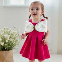 Girls Fuchsia Sleeveless Fit & Flare Party Wear Dress With Embellished Bow Applique Party Dresses