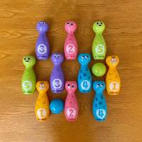 Colorful numbered bowling pins and balls for kids activity game