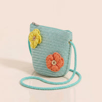Girls green woven sling bag featuring yellow and orange floral applique