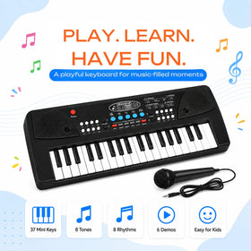 Young boy playing a black 37-key electronic piano keyboard with an attached microphone