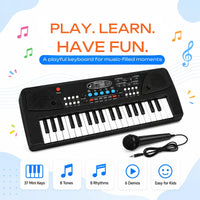 Young boy playing a black 37-key electronic piano keyboard with an attached microphone