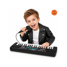 Young boy playing a black 37-key electronic piano keyboard with an attached microphone