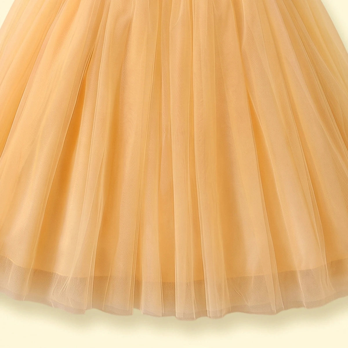 Girls yellow sleeveless party gown with sequined bodice and floral applique
