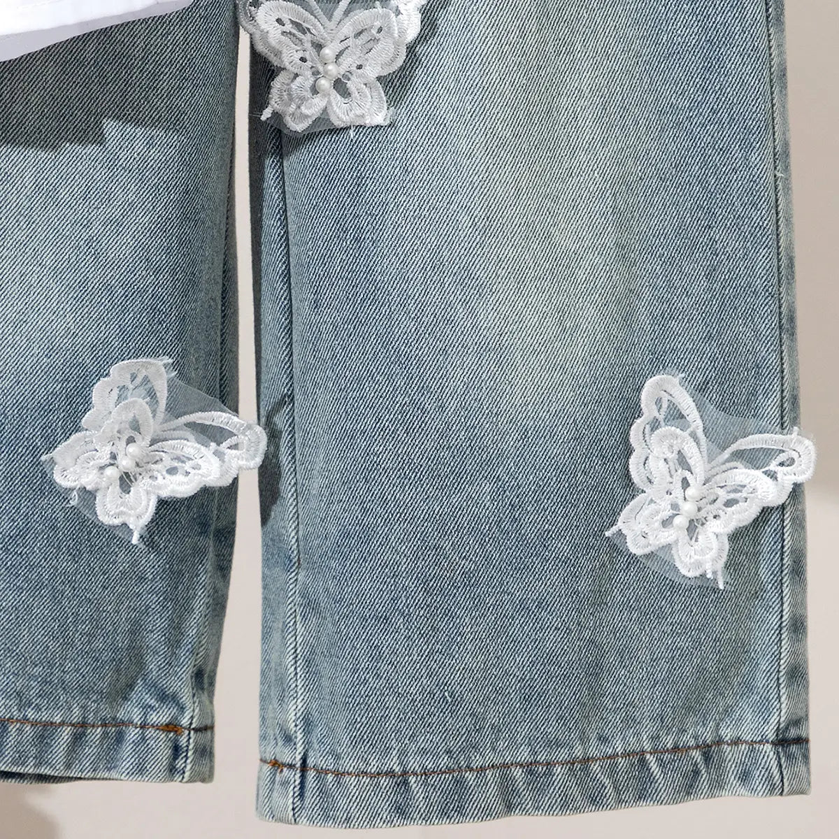 Girls White Sleeveless Peplum Top & Denim Pants With Butterfly Applique Sets Sets