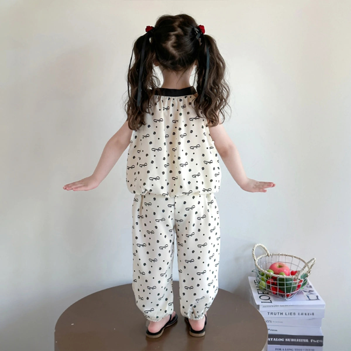 Girls Cream Bow Print Sleeveless Top With Elasticated Pants Sets Sets