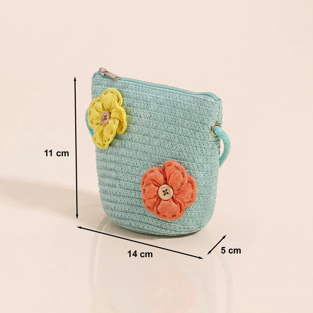 Girls green woven sling bag featuring yellow and orange floral applique