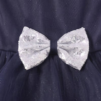 Girls navy blue party gown featuring puff sleeves and sequins