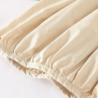 Girls Beige Solid Pinafore Dress With Sleeveless Inner Top Casual Dresses