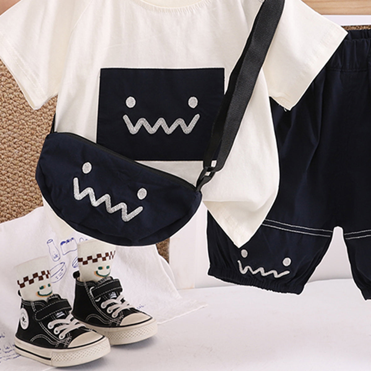 Boys Printed Appliqued T-Shirt With Black Sling Bag And Shorts Set Sets
