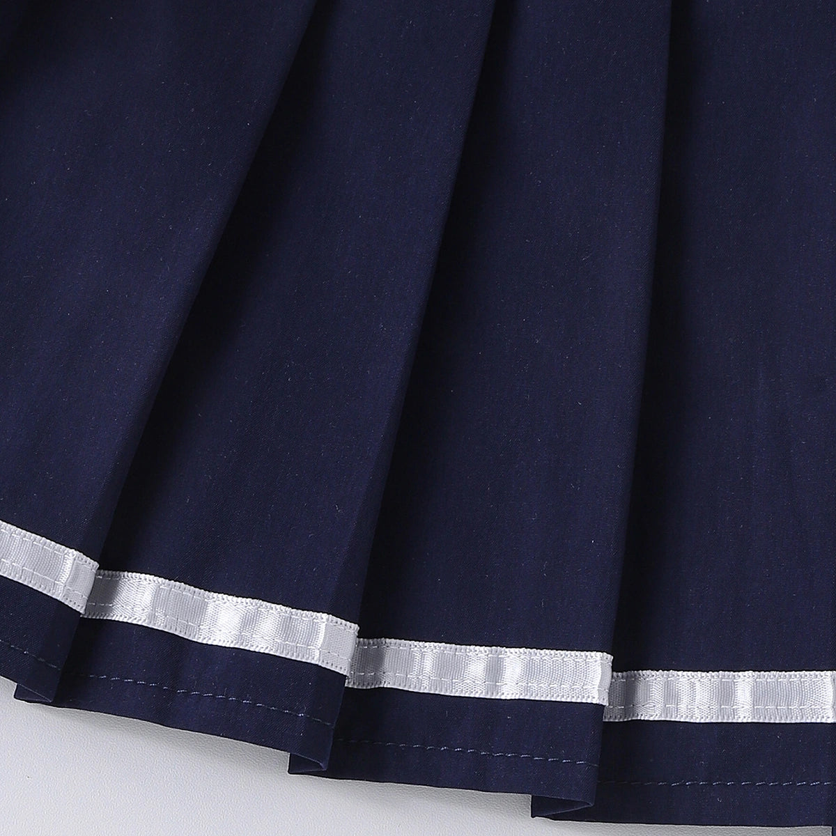 Girls Heart Embroidered Polo Top With Navy Blue Pleated Skirt Sets 2 pc. Sets