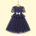 Girls navy blue party gown featuring puff sleeves and sequins