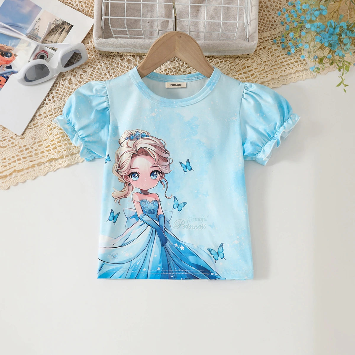 Girls Sky Blue Graphics Top With Floral Printed Denim Pants Set Sets
