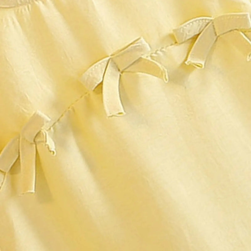 Girls Yellow Bow Appliqued A-line Dress With Ruffled Hem Casual Dresses