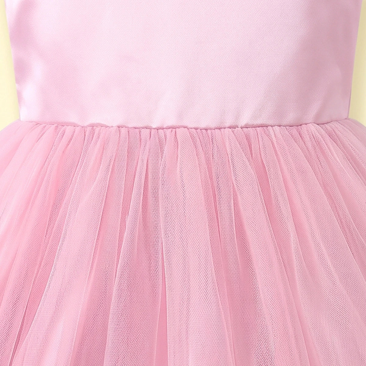 Girls light pink sleeveless high-low party dress with sequin floral applique