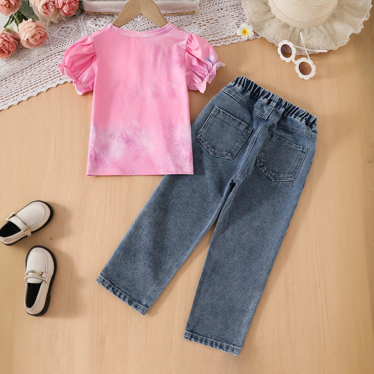 Girls Pink Graphics Puff Sleeves Top With Floral Printed Denim Pants Set Sets