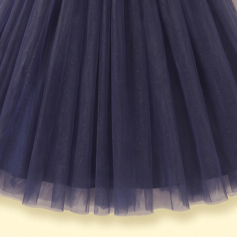 Girls navy blue party gown featuring puff sleeves and sequins