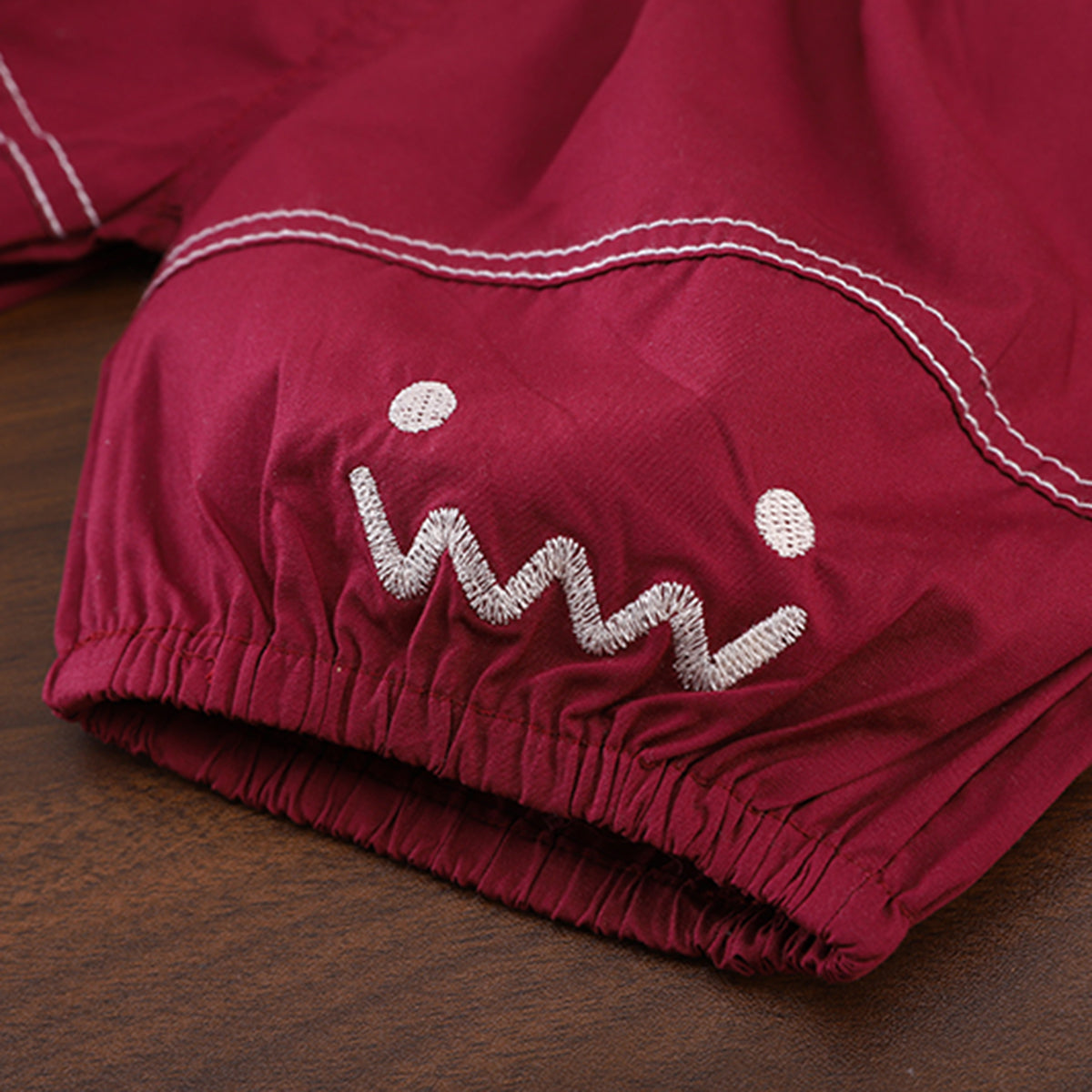 Boys Printed Applique T-Shirt With Maroon Sling Bag And Shorts Set Sets