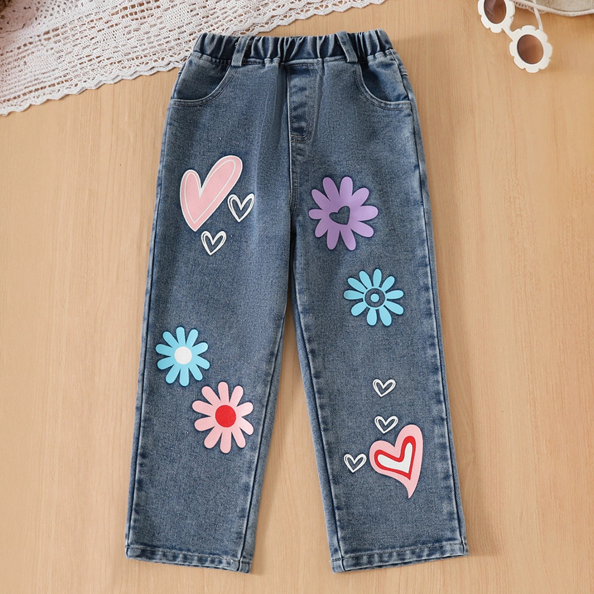 Girls Pink Graphics Puff Sleeves Top With Floral Printed Denim Pants Set Sets