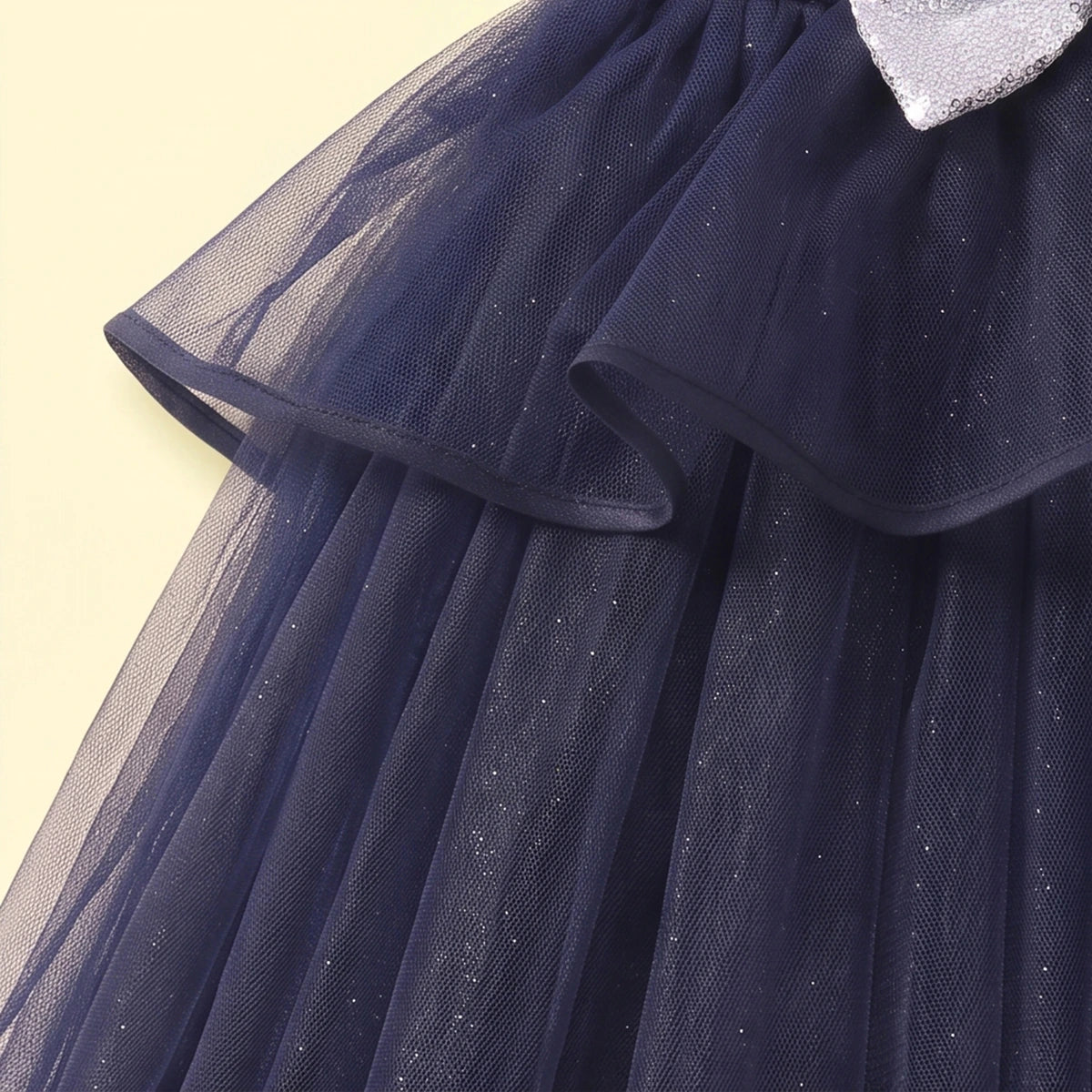 Girls navy blue party gown featuring puff sleeves and sequins