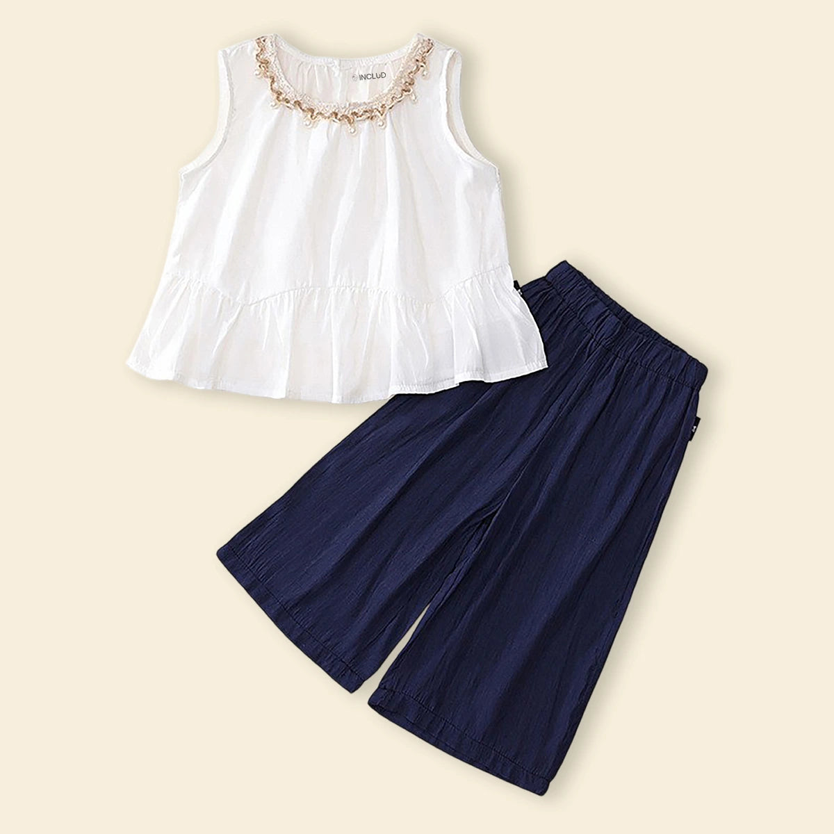 Girls White Sleeveless Peplum Top with Embellished Neckline & Pants Sets Sets