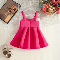 Girls Fuchsia Sleeveless Fit & Flare Party Wear Dress With Embellished Bow Applique Party Dresses